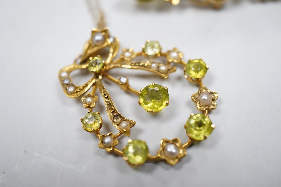 Two Edwardian peridot and seed pearl jewels, early 20th century, comprising: a bar brooch and a pendant, each of foliate design, set with circular-cut peridots and seed pearls, mounted in gold, brooch length 3.5cm, maker